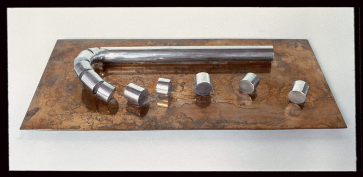 Rolling Elements, 1978, Aluminum and Brass, 7 x 50 x 30 cm. Collection of George Hines, Chicago, IL, USA. © Virginio Ferrari